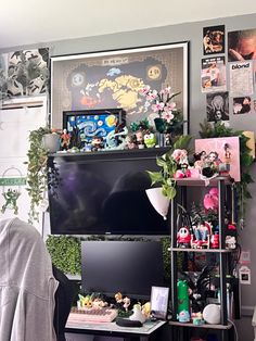 a living room filled with lots of furniture and decor on top of a tv stand