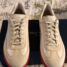 These Cole Haan Sneakers Are Sure To Make A Statement; Featuring Red Bottoms. Casual Custom Wingtip Sneakers With Textured Sole, Red High-top Sneakers For Walking, Casual Golf Shoes With White Sole, Casual Golf Shoes With Rubber Sole And Round Toe, Red Lace-up Walking Sneakers, Casual Custom Sneakers With Red Sole And Round Toe, Sporty Red Sneakers For Walking, Casual Red Suede Custom Sneakers, Casual Lace-up Golf Shoes