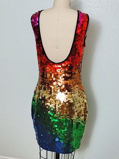 "Such a colorful dress! It's fully embellished with multi color sequins all over and in good vintage condition! Measurements: (note, the measurements range because there is some stretch in the fabric) Bust - 32-36\" Waist - 26-30\" Hips - 36-40\" Length - 34\" Tag Size - Small This dress comes from a pet-free and smoke-free home. If you would like more info or have any questions, please don't hesitate to ask!" Multicolor Sequin Fabric For Summer Night Out, Multicolor Sequin Fabric For Summer Nights, Multicolor Contrast Sequin Dress, Glamorous Multicolor Mini Dress With Contrast Sequin, Glamorous Multicolor Sequin Cocktail Dress, Glamorous Multicolor Sequin Mini Dress, Multicolor Sequin Dress For Night Out, Night Out Multicolor Sequin Dress, Multicolor Sequin Fabric For Spring Night Out