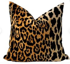 a leopard print pillow on a white background