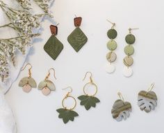 Each earring is meticulously crafted, capturing the intricate details of nature, giving them a sense of unique beauty. Each earring has a peaceful sage color that gives a calming earthy feel. Very lightweight with lots of movement!  Drop length ranges from 1 3/4" to 2 1/4"  Each pair is a one-of-a-kind, handmade with love which may include variations and imperfections.  Please check out our shop for more styles.  Follow us on instagram at @fernie.and.co Everyday Leaf-shaped Jewelry With Matching Earrings, Minimalist Leaf-shaped Jewelry With Matching Earrings, Green Minimalist Pierced Earrings, Minimalist Green Pierced Earrings, Minimalist Dangle Plug Earrings As Gift, Nature-inspired Dangle Hoop Earrings For Gift, Nature-inspired Dangle Hoop Earrings, Nature-inspired Dangle Hoop Earrings As Gift, Nature-inspired Everyday Jewelry With Matching Earrings