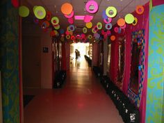 the hallway is decorated in bright colors and paper decorations