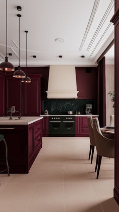 a large kitchen with red cabinets and marble counter tops