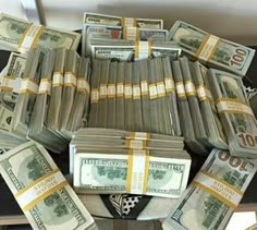 many bundles of money are stacked on top of each other