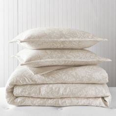 four pillows stacked on top of each other