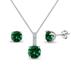 Wear this stylish jewelry set to enhance your daytime and evening attire. This beautiful jewelry set includes stud earrings with a matching necklace that features round simulated emerald gemstones in a white topaz encrusted crown setting. This stunning set is crafted of fine sterling silver, and is nickel & tarnish free. The necklace secures by a spring-ring clasp and measures 18 inches in length and 7mm in width and height. The earrings secure by post with friction-backs and measure 6mm in Crown Necklace, Topaz Jewelry, Indian Jewelry Sets, Women's Jewelry Sets, Crystal Choker, Gemstone Necklace Pendant, Emerald Jewelry, Stud Earrings Set, Topaz Gemstone