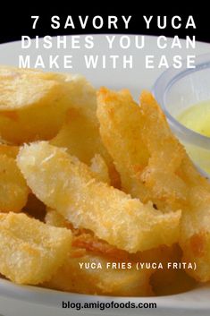 some fried food on a white plate with dipping sauce in the bowl next to it