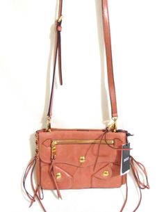 DKNY Small Dana Crossbody DP306 $298 DKNY Small Dana Crossbody DP306 $298 All items come from a NON-SMOKING & PET FREE environment. Buy with confidence! DKNY Small Dana Crossbody DP306                    1-in-D1          retail $298.00 It's all about the details with the DKNY Dana Crossbody. Lace-up side accents, front fringed pulls and shiny gold-tone hardware edge up this city-chic design. Small sized bag; approx W 9-1/4" x H 5-3/4" x 3D (width is measured across the bottom of handbag)  21"L t Front Fringe, Velvet Choker, Purple Velvet, Tag Sale, Heart Studs, Ralph Lauren Womens, City Chic, Chic Design, Small Bag