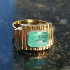 RING SIZE: US 7 1/2 EU 55 TOP PART SIZE: 12mm x 19mm METAL TYPE: 18k Gold Hallmarked WEIGHT: 5.70 grams EMERALD: 10mm x 8mm x 4mm (ca. 2.2 ct. based on calculations) CONDITION: EXCELLENT Indulge in the epitome of timeless elegance with this Natural High-Quality Emerald Art Deco Ring, a masterpiece intricately crafted during the esteemed 1930s era. The ring boasts an exquisite emerald, its rich green hue symbolizing renewal and harmony, encased in solid 18k gold marked with the distinguished 1867 Art Deco Emerald Ring With 17 Jewels, Antique Yellow Gold Emerald Ring, Antique Emerald Ring In Yellow Gold, Antique Emerald Ring In Stamped 14k Yellow Gold, Modernist Yellow Gold Signet Ring For Anniversary, Art Deco Rectangular Emerald Ring For Formal Occasions, Collectible Art Deco Emerald Ring, Vintage Yellow Gold Signet Ring With Gemstone, Art Deco Emerald Ring With 17 Jewels For Anniversary