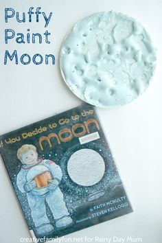 the moon is next to a book about puffy paint and how to use it