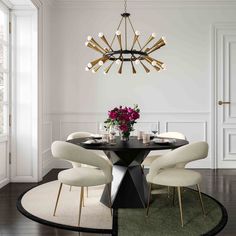 an elegant dining room with white chairs and a black table surrounded by round rugs