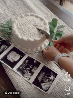 a cake sitting on top of a table next to photos