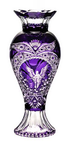 a purple glass vase with an angel on it