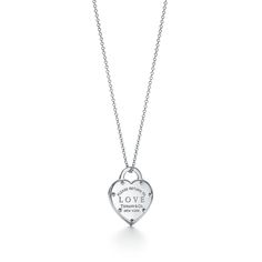 This heart-shaped sterling silver pendant features our distinctive Return to Tiffany inscription, with the addition of a bold-type "Love" motif. Inspired by the iconic key ring first introduced in 1969, the Return to Tiffany collection is a classic reinvented. Wear this playful pendant to add a romantic note to an otherwise minimal look. Sterling silver; On an 18-20" adjustable chain | Return to Tiffany® Love Pendant in Silver, Size: 18-20 in. Amber Engagement Ring, Diamond Drop Necklace, Return To Tiffany, Tiffany Necklace, Contemporary Necklace, Lock Necklace, Love Pendant, Tiffany Jewelry, Heart Pendant Diamond