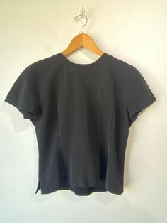 Yoshie Inaba Black Top! Short sleeves, crewneck collar, and buttons up the back. Unlined. Made in Japan. Would best fit a size small, please refer to measurements. In excellent condition! Approx. Measurements: Underarm to Underarm: 17.5" Length: 21" Classic Fitted Tops With Structured Shoulders, Black Short Sleeve Crew Neck Top For Work, Casual Fitted Tops With Structured Shoulders, Casual Fitted Top With Button Back, Classic Button-back Tops For Workwear, Fitted Button Back Tops For Work, Classic Fitted Short Sleeve Top For Work, Black Crew Neck Blouse For Work, Stretch Crew Neck Short Sleeve Top For Work