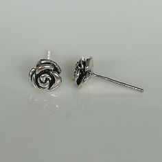 ▪︎ Sterling silver rose flower ear studs. Comes with an oxidized finish. ▪︎ Dimensions: 6.5 mm ▪︎ These studs are handmade with hypoallergenic 925 sterling silver ▪︎ I can send this piece in a gift box or include a gift message from you if required. ▪︎▪︎ Please read my shipping policies for shipping durations. ▪︎▪︎ Do contact me if you have any questions at nkapoor1955@gmail.com ➤ For more ear hoops please browse https://www.etsy.com/shop/NeverEndingSilver?ref=seller-platform-mcnav&section_i Silver Sterling Earrings With Rose Design, Silver Studs For Pierced Ears As Gift, Silver Stud Earrings As Gift, Studs Piercing, Yin Yang Bracelet, Yin Yang Charm, Wanderlust Jewelry, Flower Ear, Silver Wings