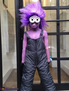 a person with purple hair and overalls standing in front of a glass door wearing an odd looking costume