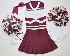 **all pieces are brand new** size girl's small -- fits little girl's size 5  measurements below-- adorable complete 8 piece set!  cheer  top & pleated skirt & bloomers 1  pair deluxe maroon / white pom poms 1 deluxe maroon/white cheer hair bow/ponytail holder pair of cheer socks arkansas & alabama colors i can add a logo for $10 top is 100% polyester  14" from shoulder to bottom hem & is approx. 12" across measured underarms laid flat not stretched.  skirt is 100% polyester.  pleated  skirt  waist measures approx. 10" unstretched/ 113" stretched & it's approx. 10.5" in front & 12" in back from waist to bottom hem outfit is ready to ship! your item will ship within 48 hours of payment! Cotton School Uniform Sets, White Cotton Cheerleading Sets, White School Uniform Sets, White Cotton School Spirit Sets, Pom Poms Cheer, Cheer Socks, Cheer Tops, Cheer Hair Bows, Bow Ponytail