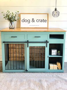 a dog and crate sitting on top of a rug next to a table with a sign