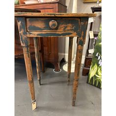 an old wooden table sitting in a room