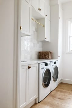 Bright upstairs laundry room featuring a modern washer and dryer, white cabinetry, and brass accents. Utility Room Inspiration, Upstairs Laundry Room, Compact Laundry Room, Upstairs Laundry, Small Utility Room, Utility Room Designs, Tiny Laundry, Ideas Habitaciones, Compact Laundry