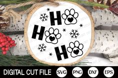 a wooden sign with paw prints and snowflakes hanging from it's side