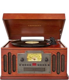 an old - fashioned record player with wooden case and radio dial, on white background