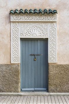 a blue door on the side of a building