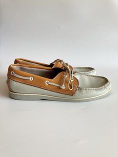 "These are vintage genuine leather boat shoes for women. They are made of genuine leather in off white color with tobacco brown accents. These deck shoes are very comforable to wear. They have a non- slip runner soles. There is no sim marked on these sailor shoes, but they fit like size US 7.5, EUR 38, UK 5. The insole length is 9.6\" / 24.5 cm. Era: 80s Brand: Sailor Condition: These shoes were much loved and the leather shoes wrinkles and scratches here and there on the leather surface, which Beige Moccasins With Stitched Sole And Round Toe, Beige Moccasins With Branded Insole And Round Toe, Casual Round Toe Loafers For Boating, Slip-on Boat Shoes With Leather Footbed, Brown Boat Shoes With Rubber Sole And Flat Heel, Slip-on Boat Shoes With Rubber Sole And Round Toe, Vintage Leather Almond Toe Moccasins, Vintage Slip-on Moccasins With Rubber Sole, Vintage Moccasins With Leather Footbed