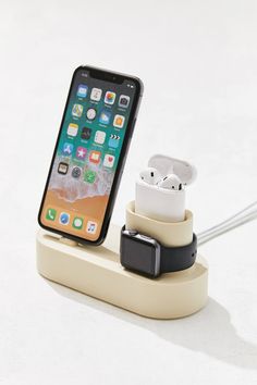 an iphone is plugged into the charging dock