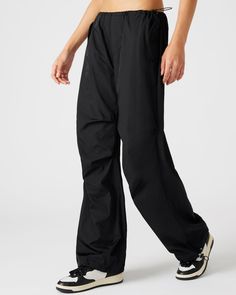 A wide leg casual pant is essential for an updated silhouette and the adjustable PIA parachute pants use stretch cord drawstrings and clever tailoring to maximize the voluminous silhouette. Wide parachute pants Zipper fly closure Two side snap pockets Stretch cord drawstring with toggle closure in waistband and cuffs Length: 30.25" 55% nylon 45% polyester Care instructions: hand wash cold separately, do not bleach, lay flat to dry, low iron if necessary, or dry clean Shop the set here Jelixza is Adjustable Pants, Parachute Pant, Casual Pant, Steve Madden Store, Side Snap, Apparel Merchandising, Casual Wide Leg Pants, Low Iron, Lay Flat