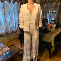 Ok Ladies, You Will Enjoy This White Polyester & Lace Jumpsuit... Can You Say, Destination Wedding!!! This Going Again Jumpsuit Is Sure To Get Attention! Whether If You're Getting Married On The Beach, Or In Las Vegas... This Jumpsuit Is To Die For! *With A Deep V-Neck *New With Tags *Sleeveless & Beautiful Lace Train Detail. *Excellent Stretch *Size Medium *Back Zipper *Back Lace Detail *Can Be Worn With Or Without Jacket (Jacket Not Included) Sleeveless Sets For Date Night, White Sleeveless Pantsuit For Night Out, Sleeveless Fitted Spring Pantsuit, Fitted Sleeveless Pantsuit For Spring, Fitted Sleeveless Spring Pantsuit, White Fitted V-neck Pantsuit, Sleeveless Spring Wedding Pantsuit, Chic Sleeveless Wedding Pantsuit, White Sleeveless Sets For Night Out