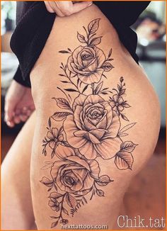 a woman's thigh with flowers on it