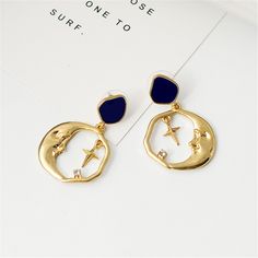 Infuse bohemian-inspired flair into your wardrobe with this pair of hoop earrings boasting a quirky crescent moon design. 1.1'' W x 1.69'' L Goldtone copper / enamel / cubic zirconia Crescent Moon Design, Vintage Drop Earrings, Celestial Jewelry, Moon Design, Round Earrings, Stars And Moon, Crescent Moon, Crescent, Sapphire Ring