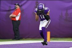 a football player is running on the field