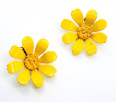 Bright Yellow Daisy Retro tin flower clip on earrings. Good vintage condition with small signs of normal vintage wear. Enamel is in good shape. Clip on vintage fastening. Earrings measure approx 1 and 3/8ths of an inch across. Vintage Flower Shaped Clip-on Earrings, Vintage Flower-shaped Clip-on Earrings, Vintage Clip-on Flower Earrings, Vintage Yellow Flower Earrings, Vintage Flower Earrings, Tin Flowers, Yellow Daisy, Flower Clip, Enamel Flower