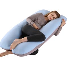 a woman laying down on an inflatable pillow