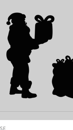 the silhouettes of two children with presents in their hands, one holding a present box