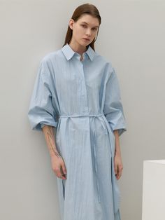 This long shirt dress from Atelier Nain features a wide placket and a half-open design, offering comfort without the gap between buttons.- With a belt to accentuate the waistline- Oversized fit for comfortable wear experience- The uneven hemline to add a unique point of interest* Model shots may differ from the actual product color due to shooting location, time, and graphic techniques. Refer to the product cut images for the actual color. Spring Midi Dress With Belted Cuffs For Daywear, Oversized Shirt Dress With Rolled Sleeves For Spring, Oversized Workwear Dresses With Placket, Midi Length Shirt Dress With Belted Cuffs For Daywear, Summer Cotton Shirt Dress With Belted Cuffs, Oversized Shirt Dress With Rolled Sleeves For Daywear, Summer Shirt Dress With Belted Cuffs For Daywear, Spring Belted Dress With Belted Cuffs For Daywear, Relaxed Fit Shirt Dress With Tie Waist For Daywear