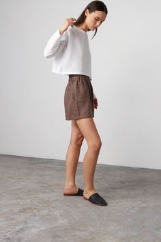 "ISLA is a high waist linen shorts. DETAILS - High waist - Elasticated waist - Side seam pockets - Oeko-Tex certified 100% lightweight linen - Cut and sewn to order just for you in our studio COLOR - Cocoa, you can also choose other colors above - Fabric samples are available here https://www.etsy.com/listing/586569696/linen-fabric-samples SIZING & FIT - Fits true to size - Model is 5'9.5\" / 177cm and wearing a size XS CARE FOR LINEN - Machine wash up to 30ºC/86ºF gentle cycle - Lay flat to dry or tumble dry low - Warm iron if needed - Do not bleach SIZE GUIDE Size conversion guide Size XS (US 0-2, IT 36-38, UK 4-6, Japan 3-5, France 32-34) Size S (US 4-6, IT 40-42, UK 8-10, Japan 7-9, France 36-38) Size M (US 8-10, IT 44-46, UK 12-14, Japan 11-13, France 40-42) Size L (US 12-14, IT 48-50 Relaxed Fit Linen Bermuda Shorts With Short Inseam, Linen Bermuda Shorts With Relaxed Fit, Linen Shorts With Short Inseam For Spring, Spring Linen Shorts With Short Inseam, Relaxed Fit Linen Shorts For Day Out, Chic Linen Shorts With Relaxed Fit, Chic Relaxed Fit Linen Shorts, Linen Bottoms With Short Inseam For Day Out, Chic Linen Shorts With Elastic Waistband