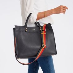 Crafted from high quality leather, our Essential Leather Tote features a spacious, open-tote design with leather carry handles and an adjustable, leather crossbody strap that can be swapped out for one of our colorful straps to create your own style. Add a foil debossed monogram to add a personal touch to your new everyday tote.    Small: 10"w x 5"d x 9"h  Large: 15"w x 5"d x 12.5"h  Camel: Smooth leather with a soft linen lining and gold-toned hardware.  Navy, Black, Sand: Pebbled leather with Handbag Essentials, Suede Tote, Mark And Graham, Work Tote, Everyday Tote, Painting Leather, Handbag Straps, Work Bag, Work Bags