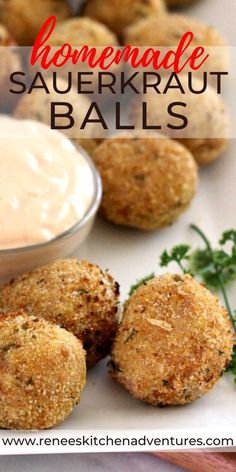 homemade sauerkraut balls on a plate with dipping sauce and parsley sprigs