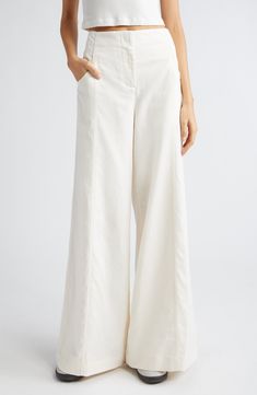 Dramatically flared wide legs lend runway-worthy movement to ultrahigh-waist pants softly kissed with fresh linen and cotton fibers. 32 1/2" inseam; 32" leg opening; 12" front rise; 15 1/2" back rise (size 8) Zip fly with hook-and-bar closure Front slant pockets 44% linen, 29% cotton, 27% lyocell Dry clean Made in the USA Pants Runway, High Waisted Linen Pants, High Waisted Flare Pants, High Waist Wide Leg Pants, Fresh Linen, High Waisted Flares, Wide Legs, Waist Pants, Linen Pants