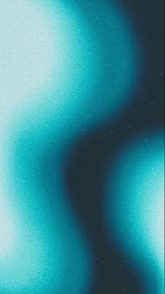 a blurry image of blue and green colors