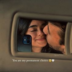 a man and woman kissing in front of a car mirror with the words you are my permanent choice