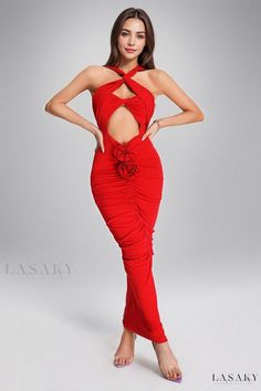 a woman in a red dress posing with her hands on her hips