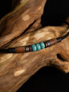 Turquoise, with its fascinating coloring, awakens a longing for distant shores and reminds us of wonderful vacation days by the sea. It is also called the protective stone of travelers; it stands for loyalty, friendship and solidarity. It is also said to strengthen the ability to protect oneself. Our Tiken necklace is presented here in an interplay of three turquoise gemstone beads with polished rosewood beads and antique stainless steel beads. The incomparable stone with its unique coloring is Artisan Adjustable Turquoise Necklace For Beach, Adjustable Bohemian Jewelry For Outdoors, Adjustable Bohemian Jewelry For Outdoor, Rustic Turquoise Jewelry For The Beach, Bohemian Adjustable Necklaces For Outdoor, Bohemian Adjustable Necklace For Outdoor, Rustic Turquoise Necklace For Gift, Spiritual Adjustable Turquoise Necklace Gift, Handmade Spiritual Necklaces For Outdoor