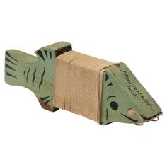 a wooden toy that is shaped like a fish