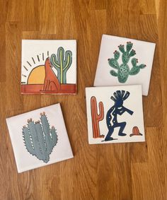 three coasters with cactus designs on them sitting on a wooden floor next to each other