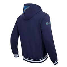 The Men's Pro Standard Navy St. Louis Blues Retro Classic Fleece Pullover Hoodie is a must-have for any devoted St. Louis Blues fan. This midweight hoodie features embroidered fabric appliques with chenille and raised details, showcasing your unwavering support for the Blues. Its cozy fleece lining and front pouch pocket provide warmth and comfort, making it perfect for chilly game days or casual wear. Represent the St. Louis Blues with pride and style in this classic pullover hoodie. Hooded Mac Navy Sporty Hoodie With Kangaroo Pocket, Navy Athleisure Hoodie With Double-lined Hood, Navy Double-lined Hood Hoodie For Athleisure, Navy Crew Neck Sports Hoodie, Navy Crew Neck Hoodie For Sports, Navy Sportswear Hoodie, Navy Hooded Sportswear Hoodie, Navy Sweatshirt With Ribbed Cuffs For Sports, Navy Fleece Sweatshirt With Kangaroo Pocket